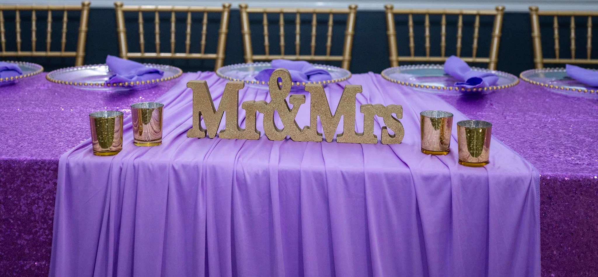 Los Olivos purple table detail with Mr and Mrs decor